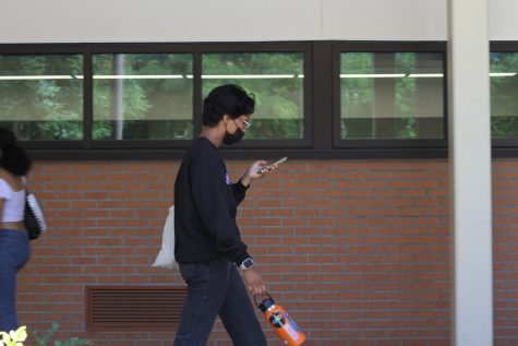 Students continue to wear masks on campus amid uptick of COVID-19 cases.