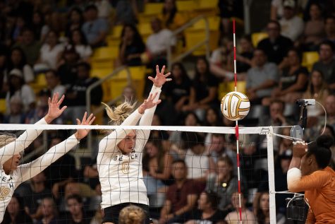 08/25/2023 - Long Beach, Calif: Long Beach State women's volleyball redshirt junior outside hitter Abby Karich (white #0) jumps up for a block attempt during the Beach's matchup with the University of Texas at Austin Longhorns. Karich would record 0 blocks but finshed the game with two digs and 10 kills in the victory over the Longhorns.