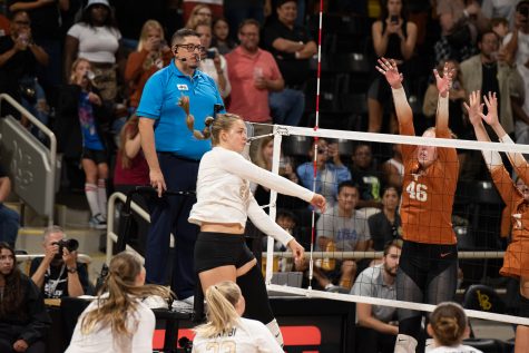 08/25/2023 - Long Beach, Calif: Long Beach State women's volleyball junior outside hitter Elise Agi (white #24) leaps up for the kill against the University of Texas at Austin Longhorns. Agi would finish the game with two kills on three total attempts.