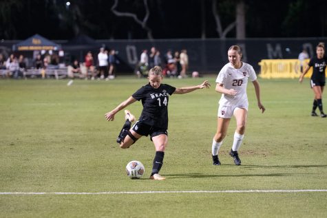 09/01/2023 - Long Beach, Calif: Long Beach State women's soccer redshirt sophomore midfielder Morgan Irvine strikes the ball into the box during the Beach's matchup against Harvard at George H. Allen Field. The Beach would win the game 3-2 following a scoreless first half from both teams.