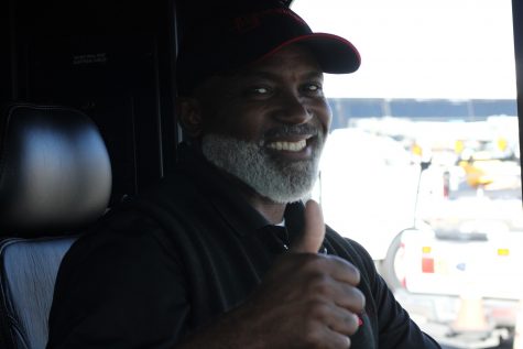 09/06/2023 - Long Beach, Calif: Arthur Mitchell gives his million-dollar smile as he backs up one of many Long Beach Transit buses away from his parking spot. The laid back bus operator is a huge sports fan.