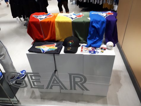 Pride-themed merch being sold at the Rodgers Centre in 2019. The Blue Jays released a player Anthony Bass in 2023 after anti-LGBTQ messages.