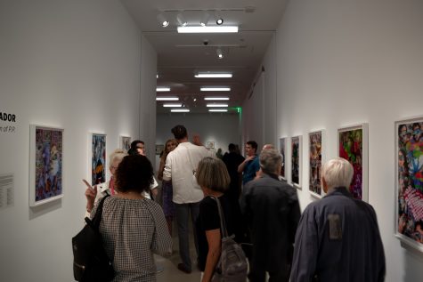 The opening night of the "Drag Show" exhibition was bustling with visitors and featured outdoor activities and drag performances. Pescador&squot;s work is pictured in one section of the gallery.