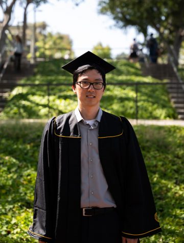 Kyle Yang graduated from CSULB in 2021 with a Bachelor's in Mechanical Engineering. Yang poses for a portrait in the long stairs next to the USU.