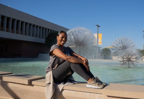 Fourth-year Public Relations major J'Shawn Lyons poses for an overall shot in front of the Brotman Hall fountain during golden hour.