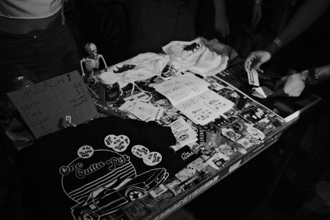 Before and after the show, bands sell a combination homemade shirts, stickers, and posters to fans.