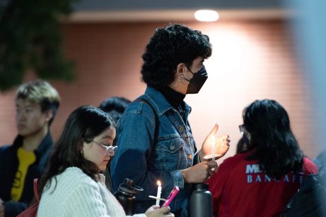 Students take part in a candlelight vigil just outside Brotman Hall by the fountain on Oct. 25, 2023, to commemorate the lives lost during the Palestine-Israel confict in the Middle East.