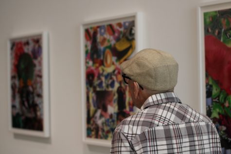 10/3/2023 - Long Beach, Calif: Michael Gavin leans back and watches some of the art work and takes in the artist talk before the event started. Throughout the event, Gavin payed close attention, focusing his full attention to Pau Pescador, nodding his head with every sentence.