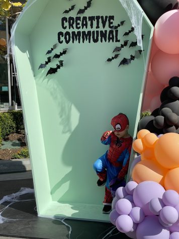 10/22/2023 - Long Beach, Calif: James Lusk holding an on-brand Spiderman pose while in costume at one of the photo-op locations at the Creative Communal market, which he attended with his family.