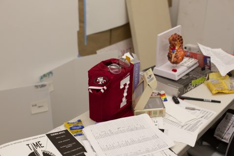 Krob shared that their father's ashes were in the studio decorated with a San Francisco 49ers jersey. Krob's father had Polycystic Kidney Disorder (PKD) and so does Krob. They have made work about their father's death and continue to make work about and with the PKD community.