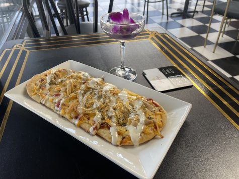 The menu offers a wide variety of drinks and appetizers including some of the restaurants most popular choices: the vintage violet and buffalo chicken flatbread.