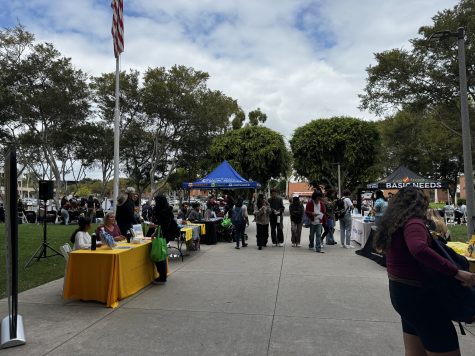 10/25/2023 - Long Beach, Calif: Students attending the booths at the I Stand with Immigrants & CalFresh Resource fair. Each booth represented a different resource.
