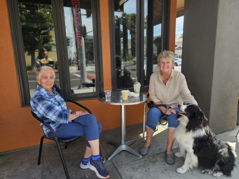 Jackie Dejung (left), Dianna Geosano (right) and her dog Hank are regulars at Hot Java. The friends often stop by when taking Hank for a walk to get him a "puppuccino."
