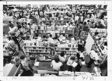 Students queue up for textbook checkout in the 1980s. Now, textbooks are on their way out.