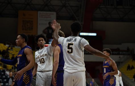 Freshman guard Jason Hart Jr and sophomore guard AJ George high fives as they dominate against CLU. LBSU finished the game with 58 paint points as they dominated in their home opener.