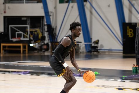 10/03/2023 - Long Beach, Calif: Long Beach State men's basketball junior forward Aboubacar Traore dribbles the ball during a drill inside the Walter Pyramid. Traore won the Hustle Player award in the 2022-2023 season and looks to continue to make an impact for the Beach this upcoming season.