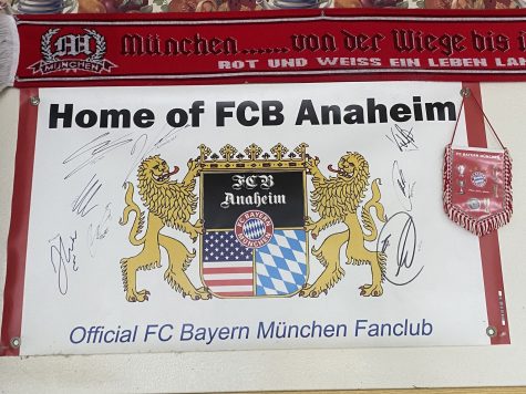 A poster signed by members of the FCB Anaheim fan club hangs high on the wall.