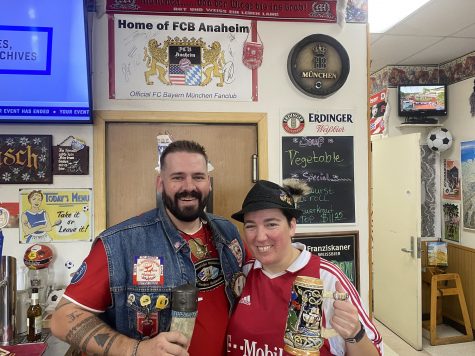 Mads Herrick (Vice President) and Nicole Geub (President) of FCB Anaheim show off their unique drinking mugs.