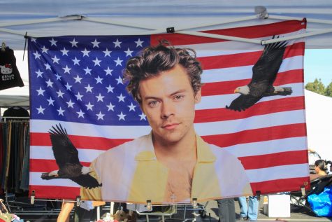 11/5/2023 - Long Beach, Calif: An American flag with musician Harry Styles in the center hung in Shanna Lyons and Lizzy Willig's vintage clothing booth.