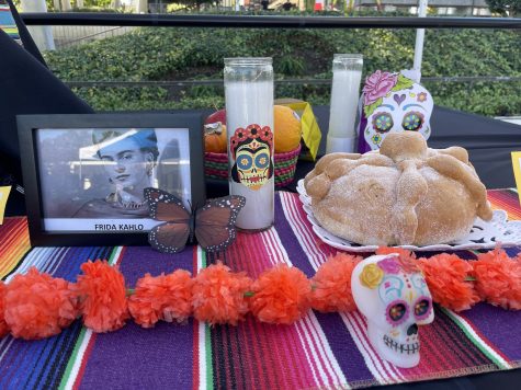 10/31/23 - Long Beach, Calif: Details at the Dia de los Muertos altar, or "ofrenda,” featuring "pan de muerto," candles and sugar skulls to honor Mexican artist Frida Kahlo.