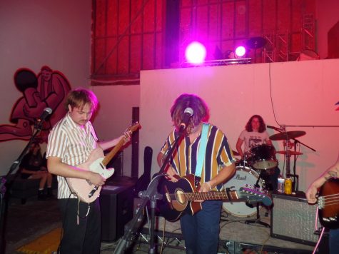 In between songs, Jackson Jones (left) and Hunter Kelly (right) retune instruments.