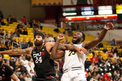 12/30/23 - Long Beach, Calif: Junior forward Lassina Traore tries to box out CSUN's Jasman Sangha at the free-throw line as Long Beach State tries to extend their win streak to seven. Traore scored nine points and six rebounds.