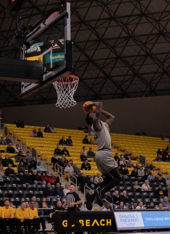 Junior forward Aboubacar Traore rises for a 360 slam on the fast break. He would finish the game with 9 points and 10 rebounds as LBSU punished the rim with countless dunks.