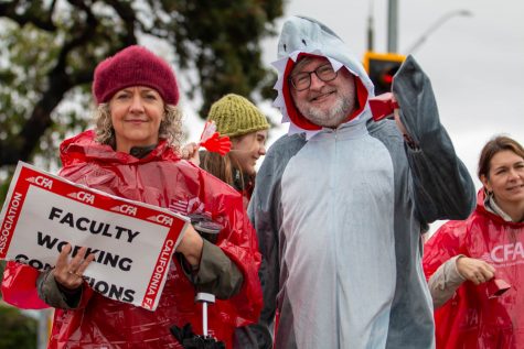 1/22/23 - Long Beach, Calif: Kent Hayward and Helen Hood Scheer, film professors at CSULB, showed up at one of the striking locations at Margo Ave. and East Campus Drive. They were one of many people who showed their support for the CFA strike on Monday.
