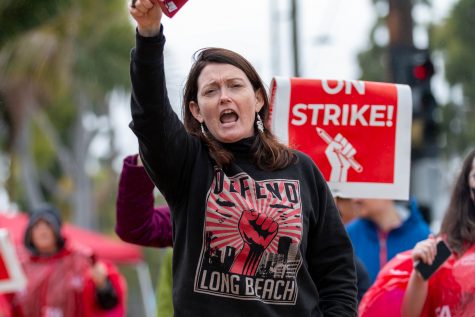 1/22/23 - Long Beach, Calif: Kimberly Walters, an international studies professor, helped lead the charge for the CLA strike on Monday at around 3 p.m. She was ringing the cowbell across one of the campus openings at the Walter Pyramid in Atherton St. across the street opening leading to the Pyramid.