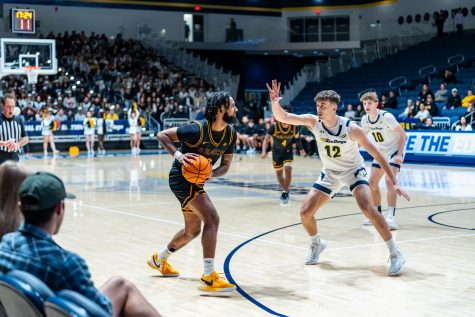 Senior guard Marcus Tsohonis being guarded by UC San Diego junior guard/forward Aniwaniwa Tait-Jones in the first half. Both were their team's leading scorers going into halftime of a tied game.