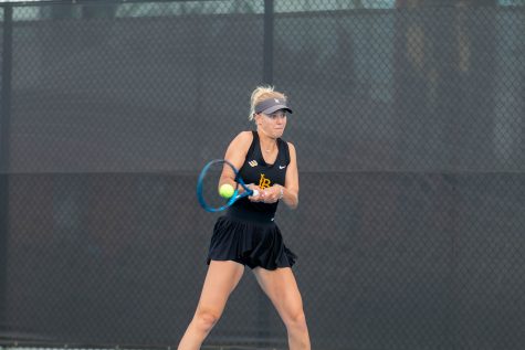 2/09/24 - Long Beach, Calif: Senior Rhona Cook crushes the ball during her singles match against LMU's Carlota Molina. Cook's doubles match with junior Peppi Ramstedt ended with a tie but she lost in singles against Molina 6-3, 6-3.