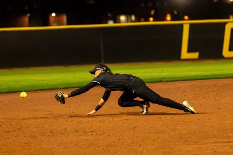 2/28/24 - Long Beach, Calif: Sophomore infielder Selena Perez dives for the ball around the third base side of the field and just misses the ball against Michigan at the LBSU Softball Complex. Perez would struggle with only one hit but The Beach's solid defense from Perez and clutch hitting beat the Wolverines 7-6 in nine innings.