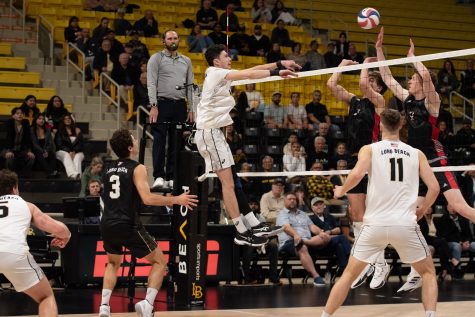 Long Beach State men's volleyball senior opposite hitter Nathan Harlan goes for a kill against the Lewis defense in their matchup inside the Walter Pyramid. Harlan went 5-10 on kill attempts while also recording four digs and three total blocks.