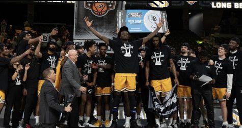 Long Beach State men's basketball on the podium to receive their first Big West Championship trophy since 2012. First-team All-Big West Aboubacar Traore recorded the first LBSU triple-double since 1990 in the team's quarterfinal victory over UC Riverside.