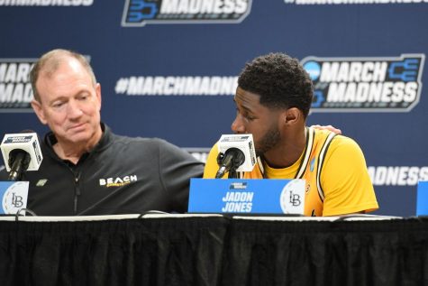LBSU head coach Dan Monson with his arm around junior guard Jadon Jones in an emotional press conference after The Beach's 86-65 loss to the Arizona Wildcats in the first round of the NCAA Tournament.