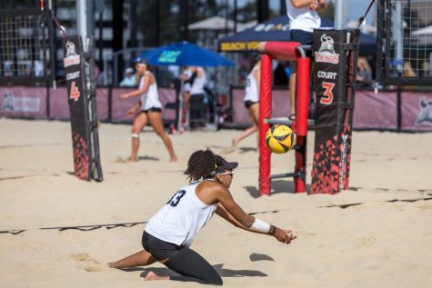 Beach volleyball's junior, Natalie Glenn dove for the ball after it was spiked by CSUN. Glenn and her partner would win their match in the second set 21-11 during the LBSU tournament.