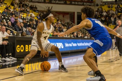 Long Beach State men's basketball senior, guard, Messiah Thompson looked for an open teammate as the final minute of the game ticked down. LBSU played UC Santa Barbara on March 7 at the Walter Pyramid with a close score of 74-76.