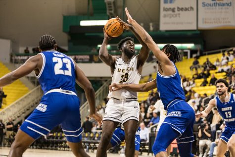 Long Beach State men's basketball junior, forward, Lassina Traore attempted a shot as UC Santa Barbara's defense applied pressure. LBSU went head-to-head against UCSB on March 7 before falling just short with a score of 74-76.
