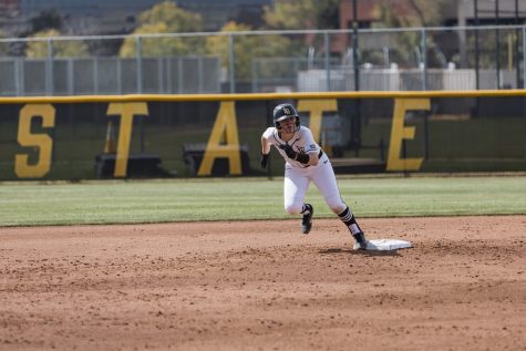 Long Beach State softball's junior infielder Carly Robbins anticipated her teammates' hit to steal third base. Robbins would get two hits in a 4-4 loss to Utah State 4-2 on extra innings Sunday at the LBSU Softball Complex.