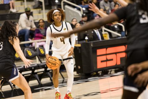 Long Beach State women's basketball guard, Cheyenne Givens looks to pass to an open teammate on a night where she was honored in Senior Night festivities. Givens went 4-5 from the field and scored 11 points, one rebound and four assists.