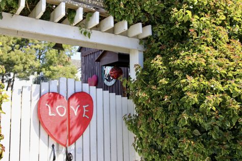 Behind the "Love" gate lies the San Benito House wedding venue, where couples can celebrate their love between flowers and foliage.