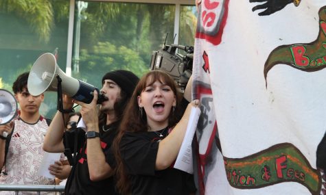 09/12/2023 - Long Beach, Calif: Student protestors carry banners in front of the entrance to the CSU Chancellor's Office in Long Beach while the trustee meeting continues.