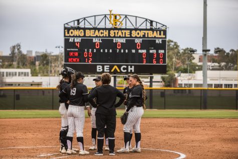 Long Beach State regrouped during a UC Santa Barbara timeout in the second inning. The Beach’s softball team defeated No. 2 UCSB 7 to 2 during the home game in April 13.